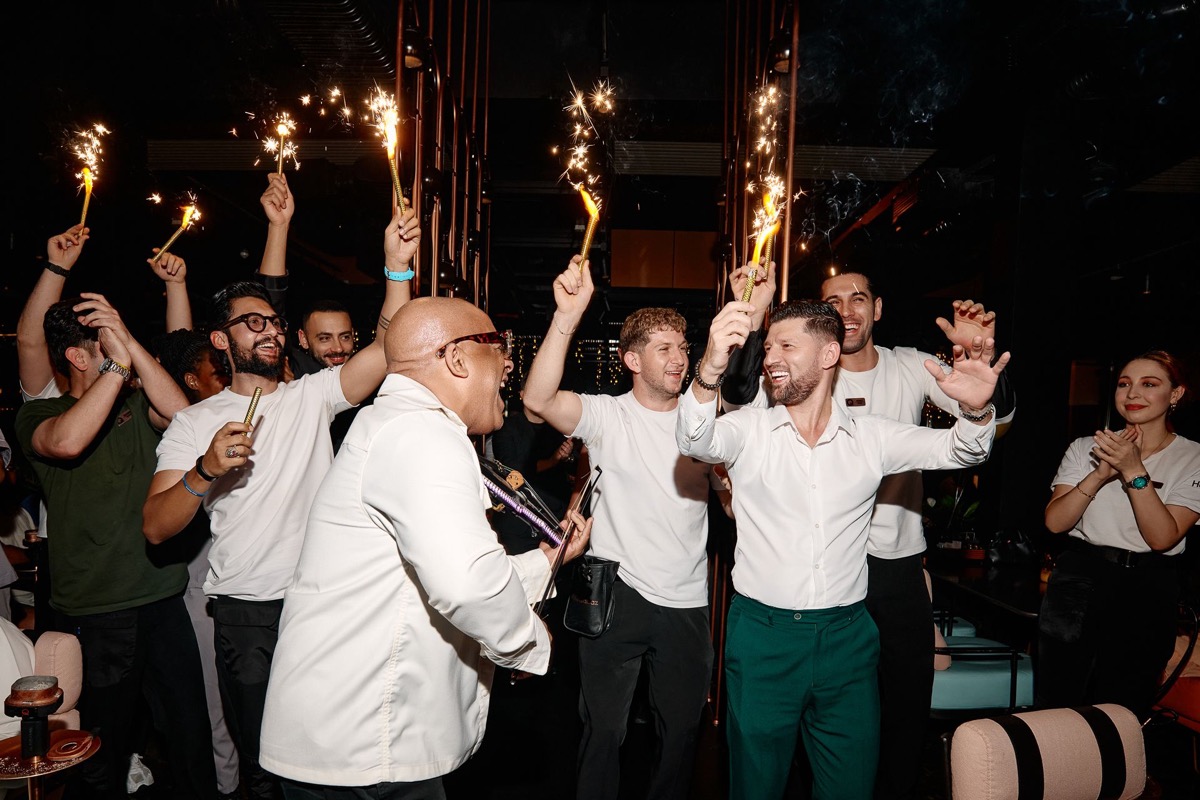 Julio Cuba celebration with crowd and sparklers at Dubai venue