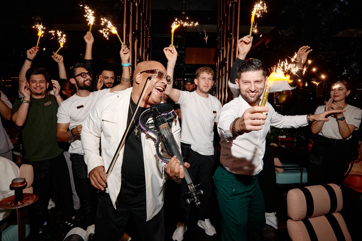 Julio Cuba with electric violin and sparklers at exclusive event